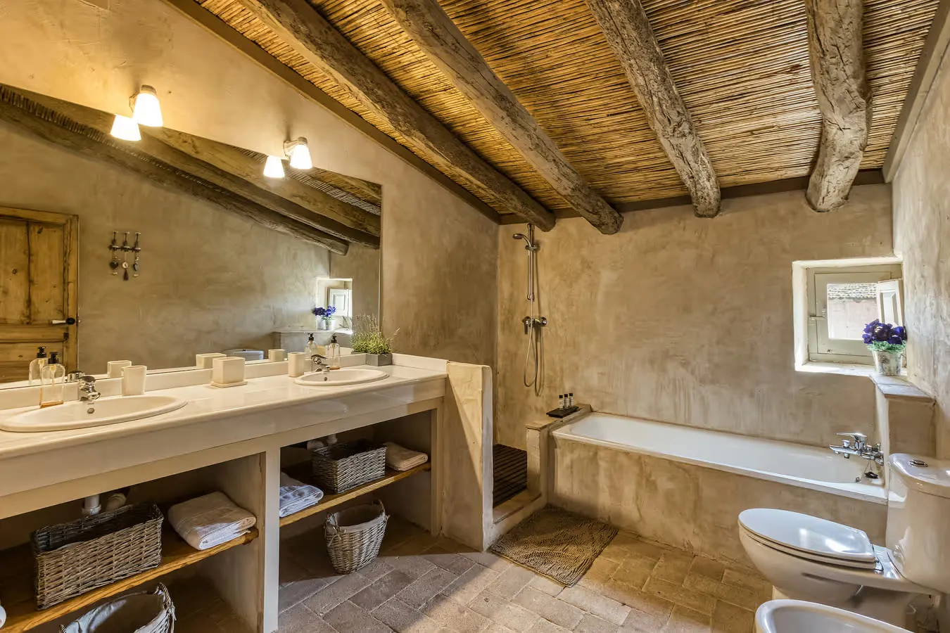 Shared bathroom with cane ceiling