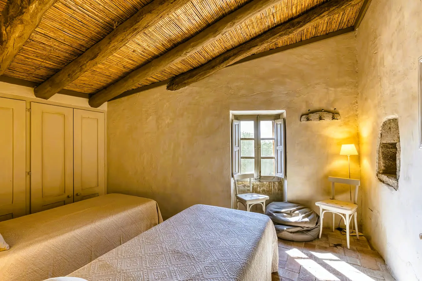 Twin bedroom with beamed ceiling